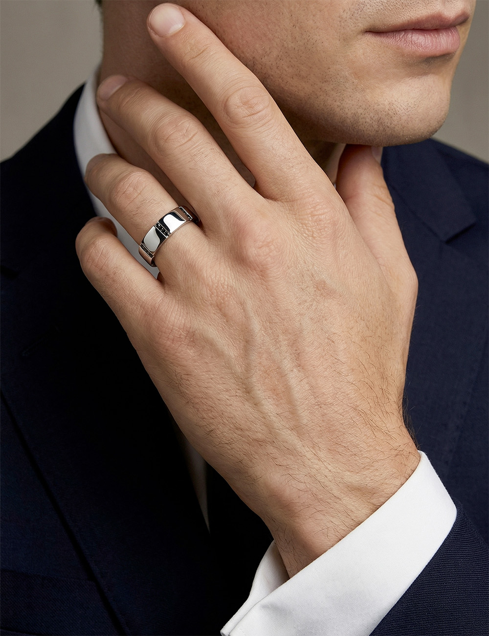 Modern men’s platinum wedding band 6 mm with black diamonds in a graphic layout.