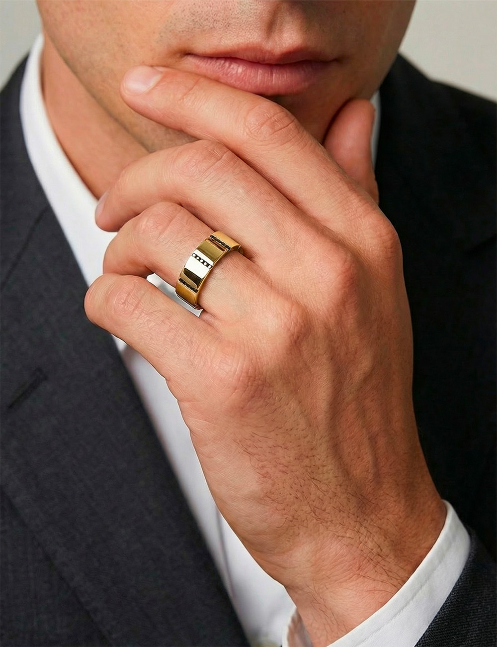 Yellow gold 7.5 mm men’s modern wedding ring featuring black diamonds and a bold graphic structure.