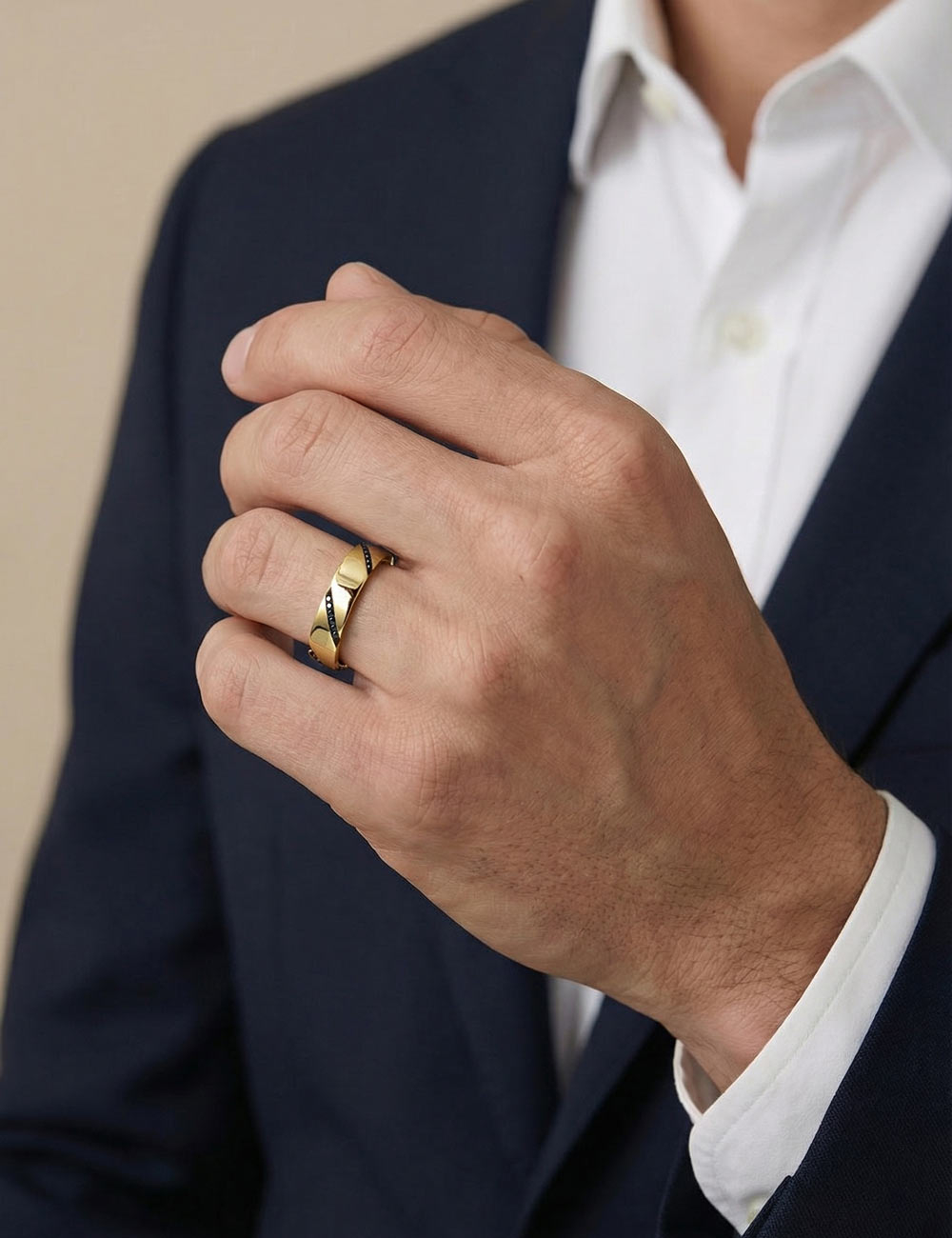 Men’s yellow gold wedding band with diagonally set black diamonds.