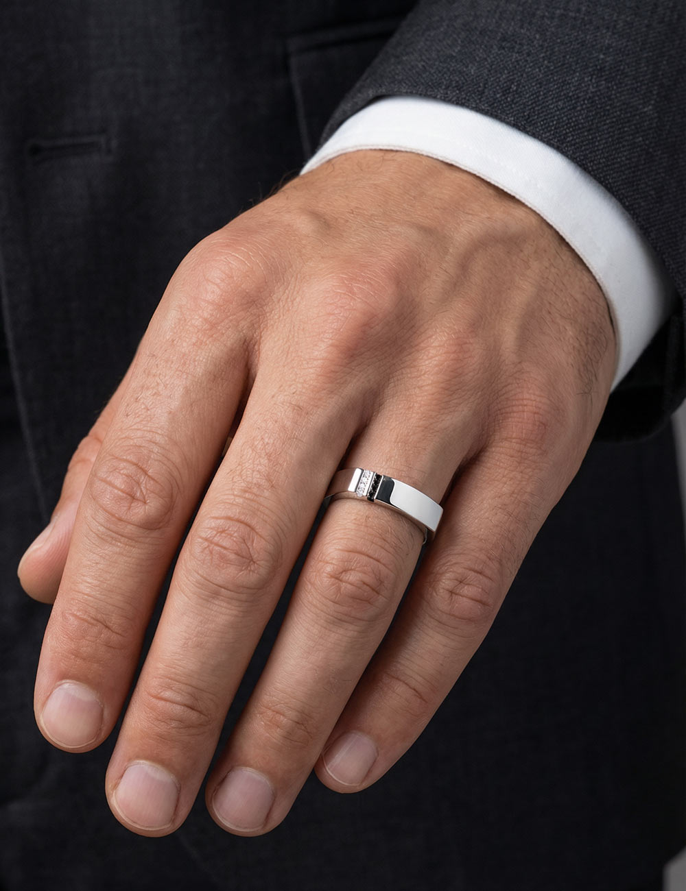 Men’s platinum ring set with white and black diamonds.