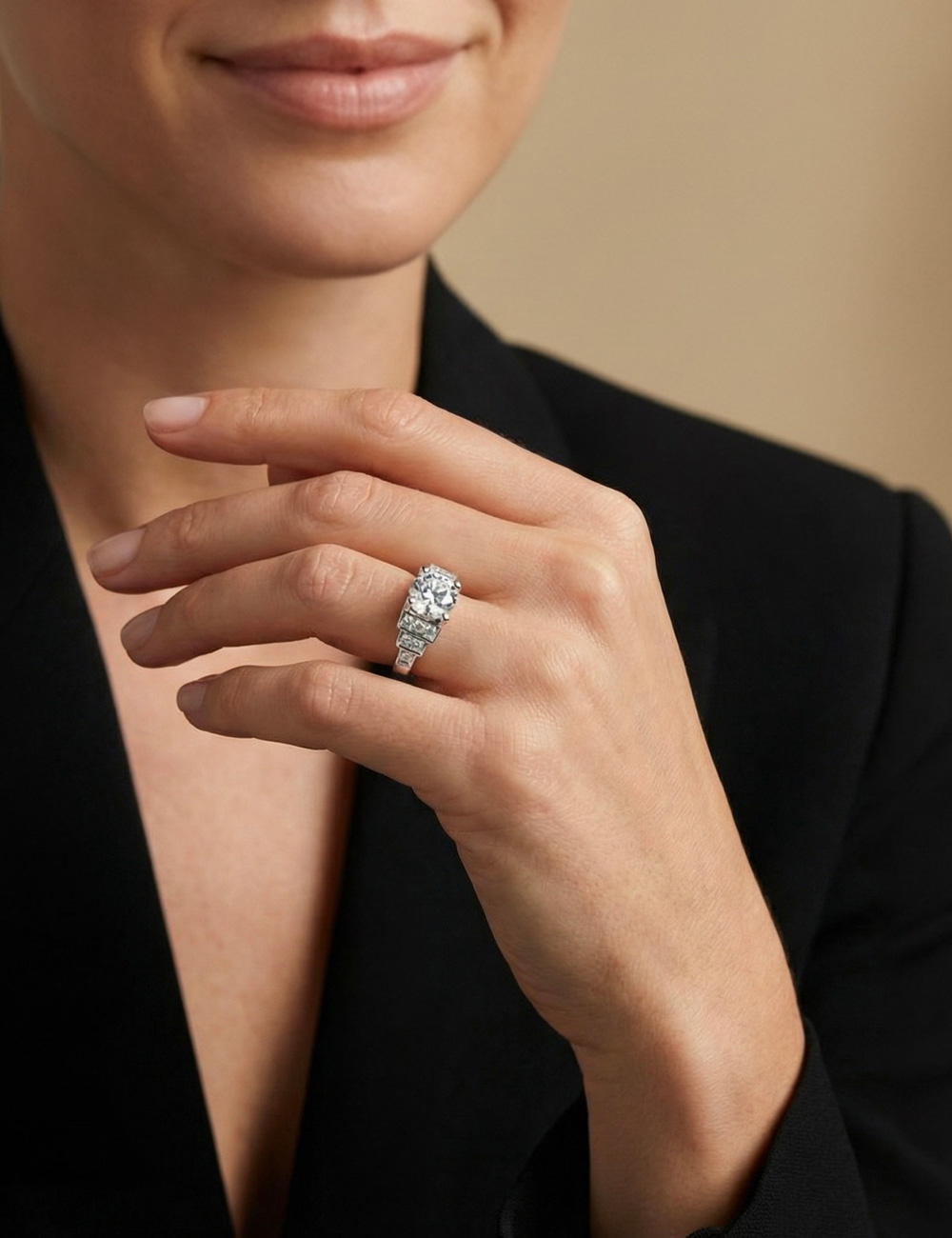 Empire platinum engagement ring with a natural white diamond, worn on the hand.