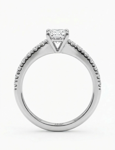 Platinum engagement ring in side profile with a 0.50 ct center diamond and pavé-set white diamonds.