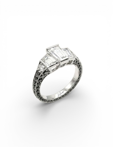 Bague L’Origine D.Bachet en platine sertie de trois diamants blancs taille à degrés et de diamants noirs.