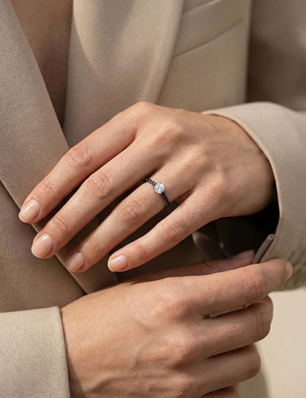 Platinum solitaire ring, round center diamond and 5 black diamonds on each side, fine modern design.