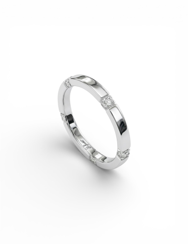 Fine platinum women’s wedding ring with five white diamond anchor points.