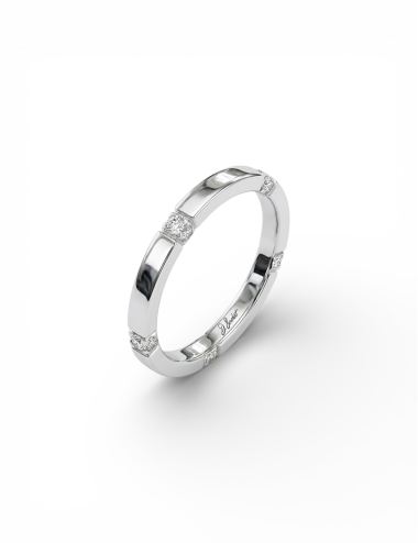 Gravity women’s platinum wedding band set with white diamonds on top and edges.