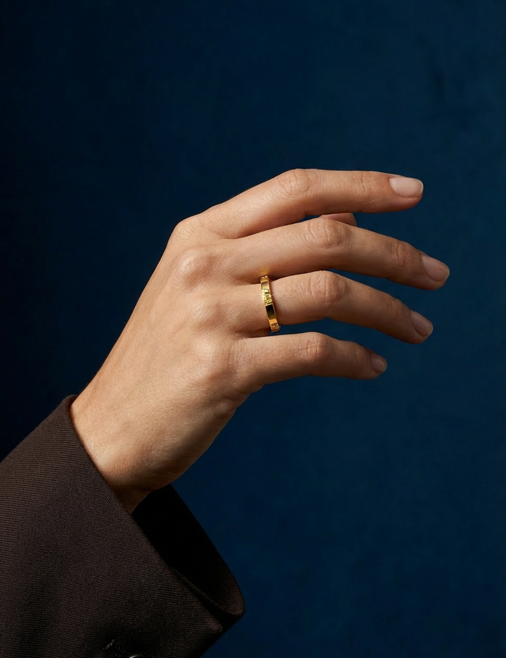 Modern 18k yellow gold women’s band with yellow diamonds visible on the side edges.