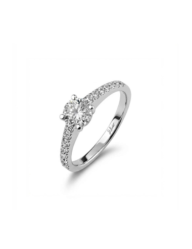 Platinum engagement ring with a 0.50 carat center diamond and seven white diamonds, modern and timeless design.