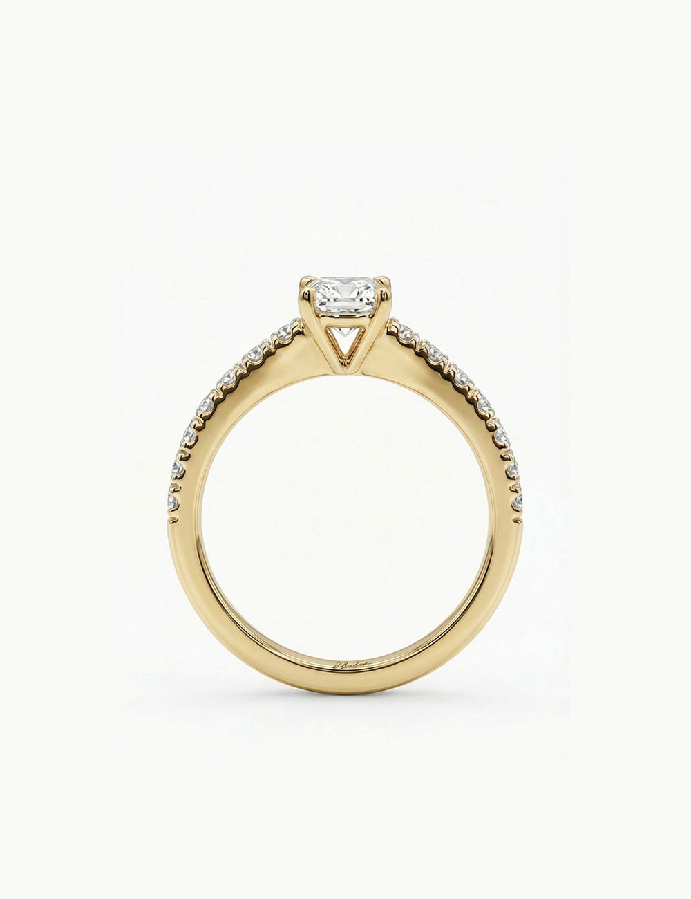 Yellow gold solitaire ring with a 0.50 carat white diamond side view and pavé diamonds.