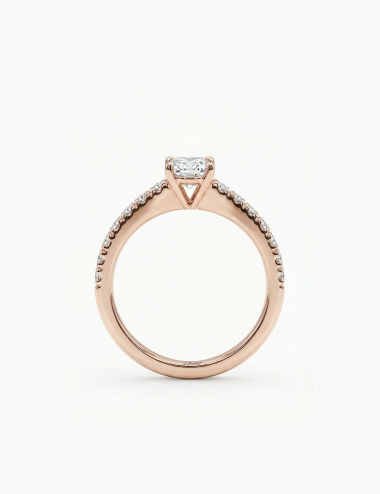 Rose gold solitaire ring with a 0.50 carat white diamond side view and pavé diamonds.