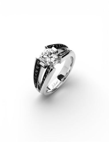 Platinum engagement ring with a 1 carat white diamond and double band set with black diamonds.