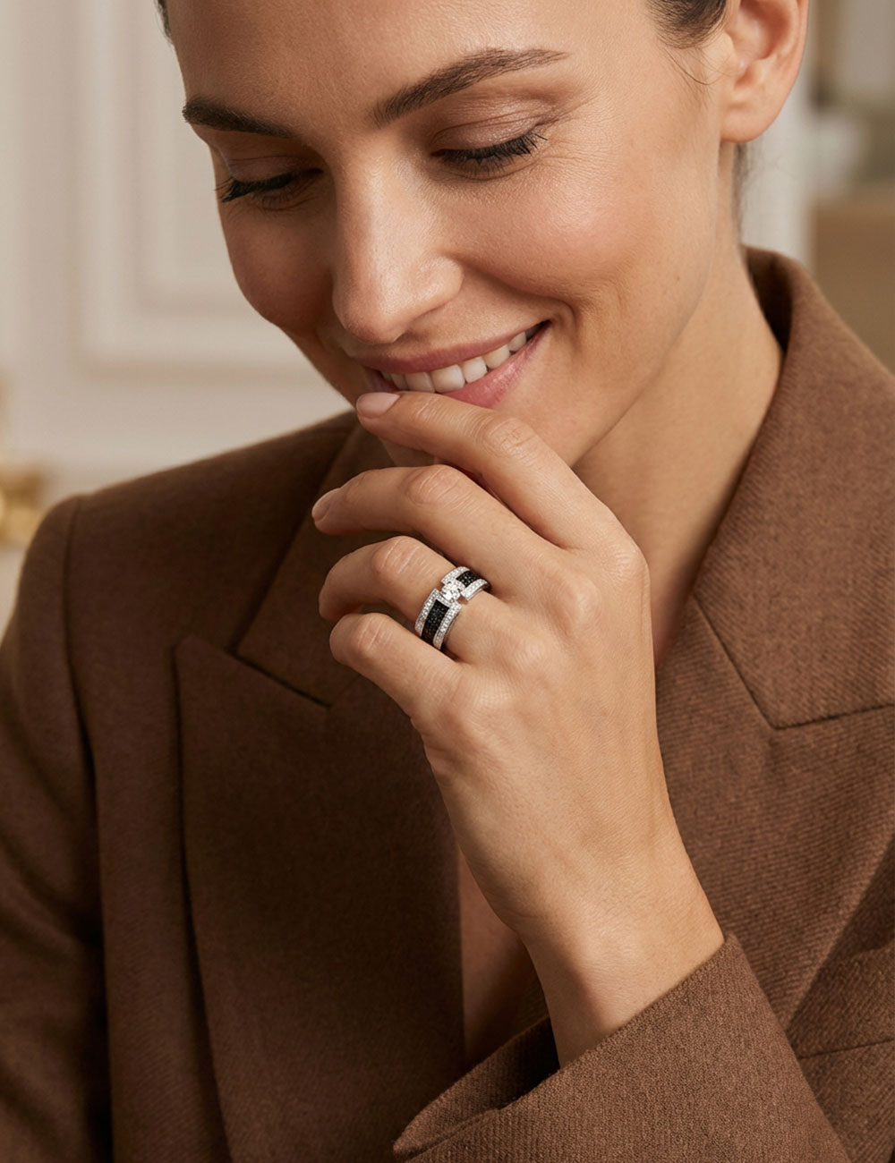 Platinum engagement ring with a 0.50 carat white diamond and black and white diamond pavé.