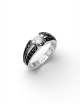 Engagement ring set with a 0.50 ct white diamond on a modern platinum band adorned with black diamonds.