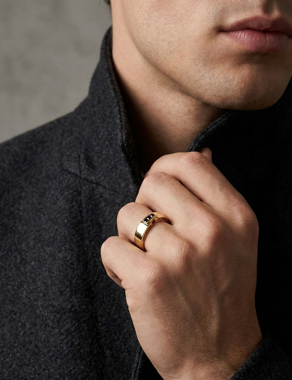 Men’s 18k yellow gold ring set with three black diamonds worn on hand, architectural design by D.Bachet.