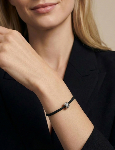 A Way to Love women's bracelet in 18k gold with white diamonds set in a bar style, double black cord.