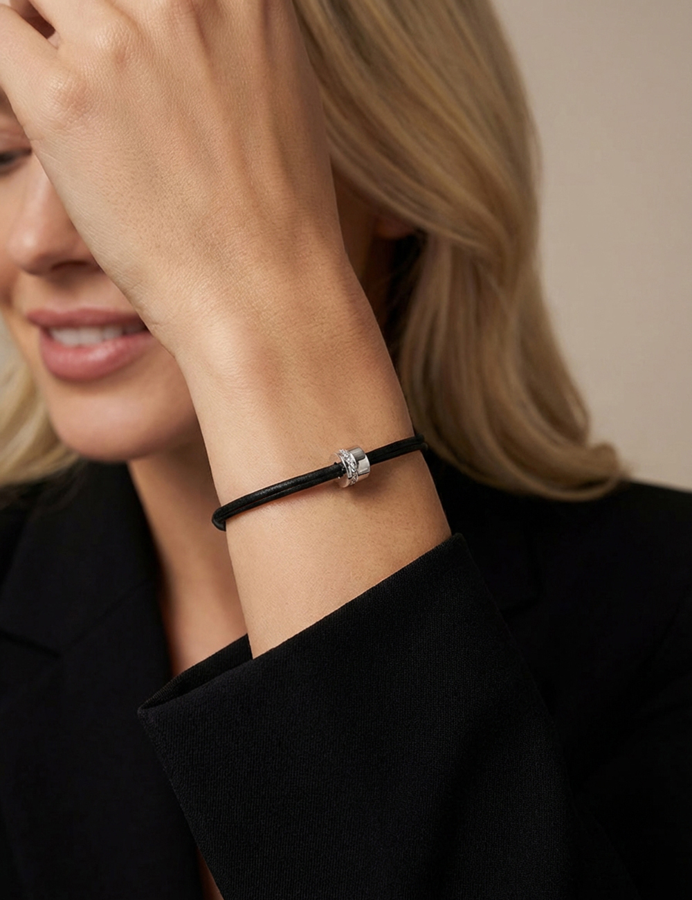 Sweet Side of Love women's white diamond bracelet in 18k gold on adjustable black cord.