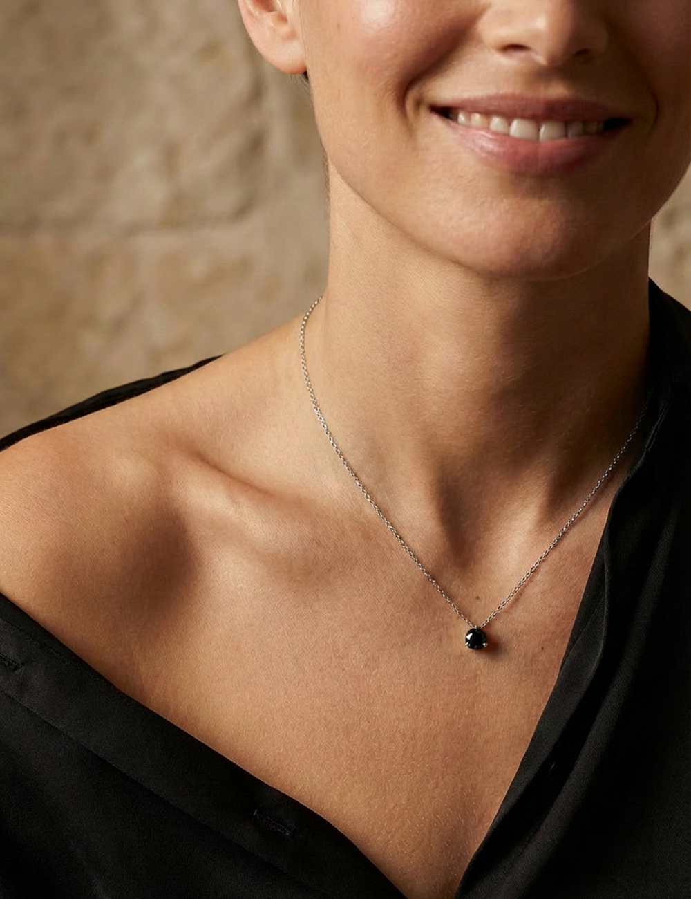 Close-up of D.Bachet 1 carat black diamond solitaire pendant in 18k white gold.