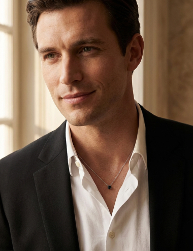 D.Bachet 1 carat black diamond solitaire pendant in white gold, worn by a man on a white shirt. Modern luxury.