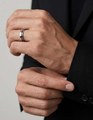 Men’s platinum wedding band featuring a side-offset line of black diamonds, clean and contemporary lines, worn.