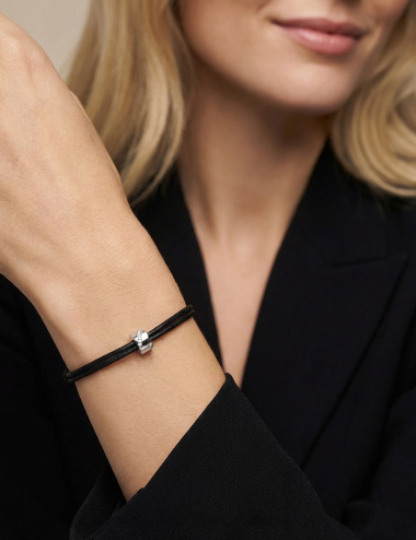 White gold and channel-set diamond cord bracelet Wrapped in Love worn alone on the wrist D.Bachet.