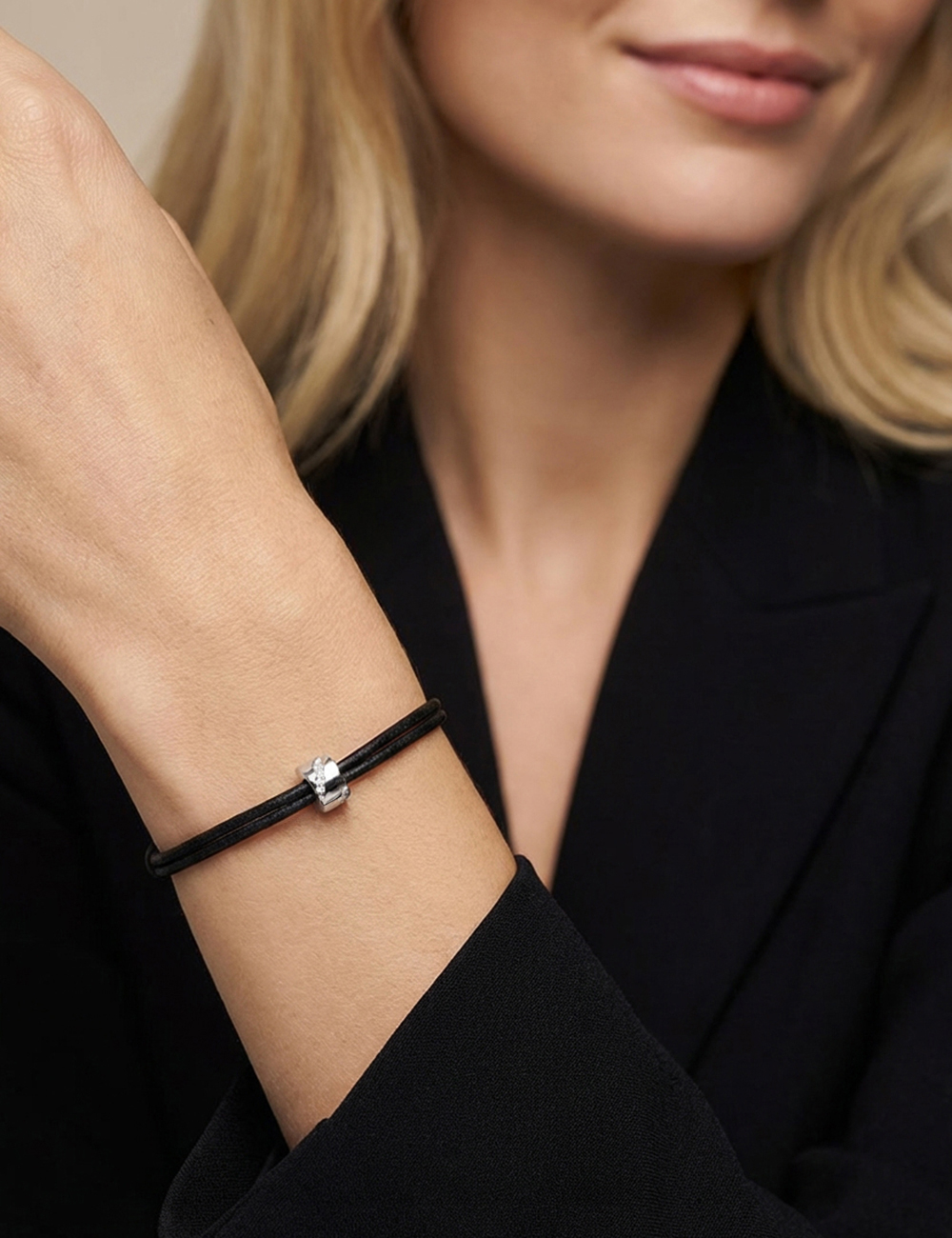 Women's black cord bracelet in white gold with a channel-set diagonal ribbon of white diamonds Wrapped in Love.