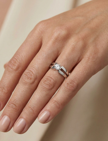 Sweet Side platinum solitaire engagement ring worn on the hand with a 0.50 carat natural white diamond.