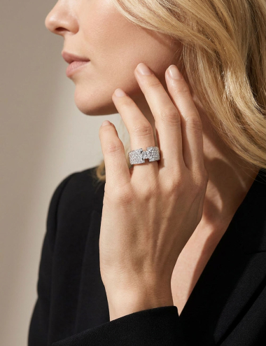 D.Bachet luxury platinum and white diamond Shine engagement ring worn on a woman's finger.