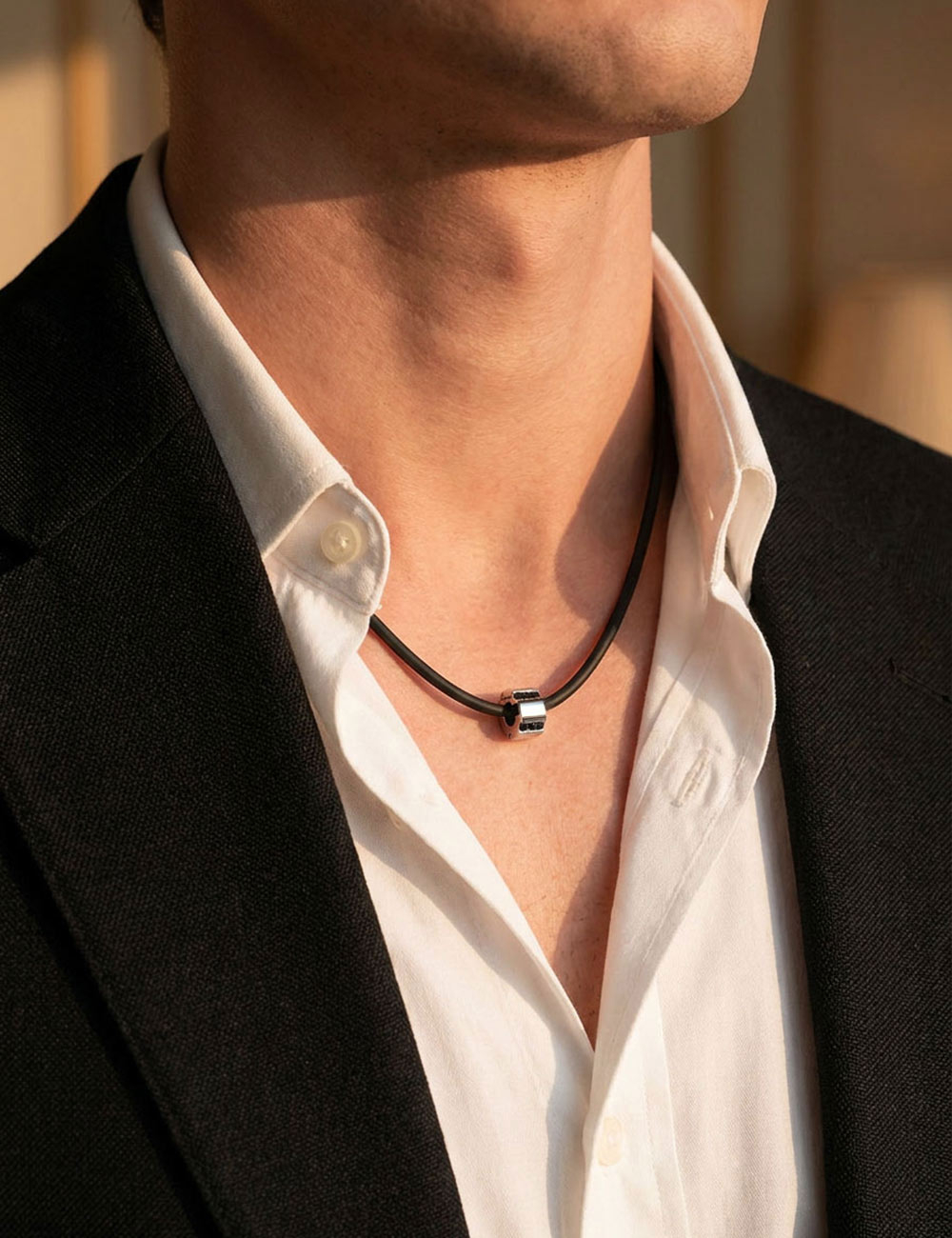 D.Bachet Bridge to Unity men's pendant in white gold and black diamonds on a black silicone cord.