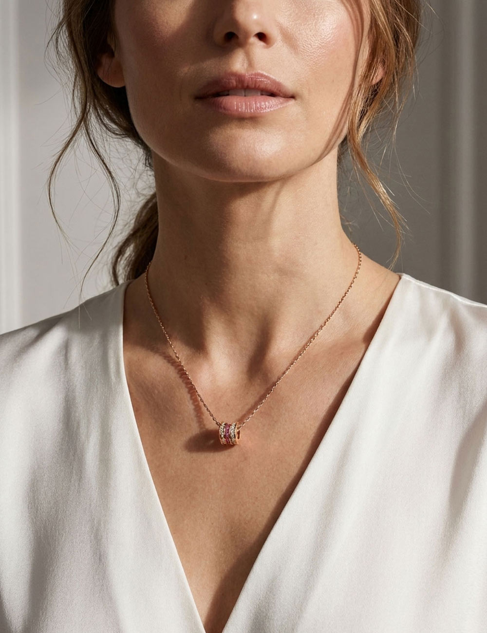 Scroll in Love pendant in 18k rose gold set with vibrant pink sapphires and brilliant white diamonds, by D.Bachet.