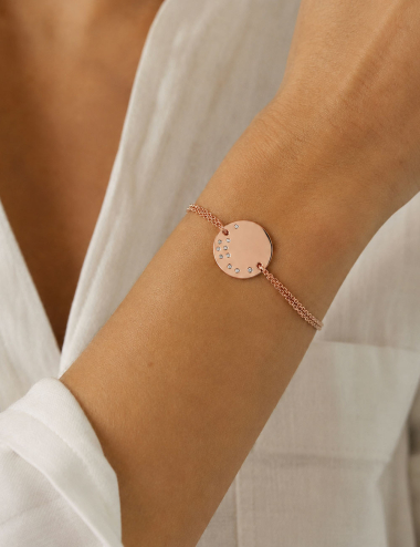 Cascade Medallion bracelet in 18K rose gold set with white diamonds, worn on the wrist.