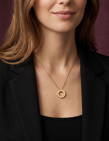 18k yellow gold Cascade pendant with white diamonds worn by a woman.