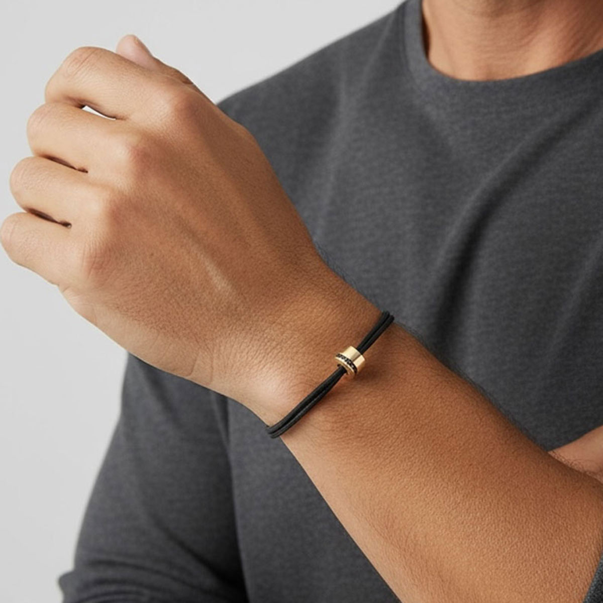 Sweet Side of Love men’s bracelet in 18k yellow gold with black diamonds on a black cotton cord