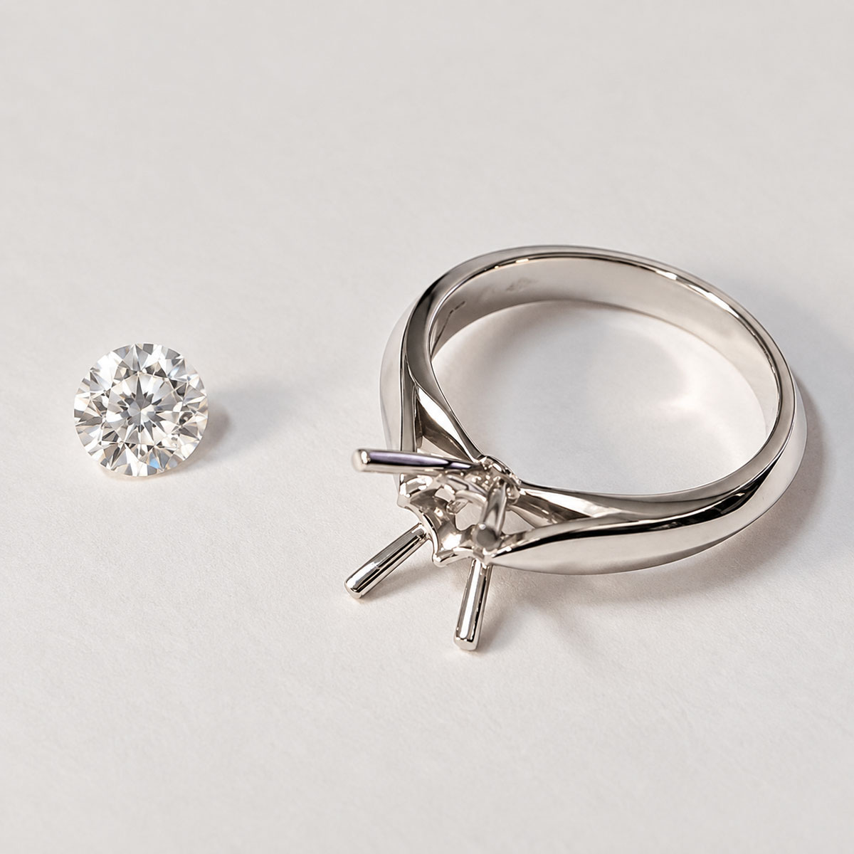 D.Bachet four-prong solitaire engagement ring with a natural white diamond before setting.